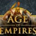 Imagen promocional del videojuego "Age of Empires" mostrando tres líderes históricos: un guerrero griego, un faraón egipcio y un emperador asiático, con escenas de batalla naval y asedio en el fondo.
