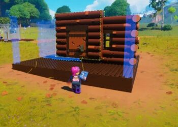 In-game image from "Lego Fortnite," featuring a character with pink hair building a simple log cabin structure out of LEGO bricks. The environment is bright and colorful, with a lush, green landscape dotted with trees and a clear blue sky. The character is equipped with a back bling and a pickaxe, standard gear for Fortnite, but with a LEGO twist. The scene captures the playful crossover between LEGO's imaginative building and Fortnite's survival gameplay.