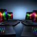 Portátiles Razer Blade con iluminación RGB en sus teclados y vibrantes pantallas, diseñados para ofrecer una experiencia gaming superior.