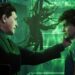 A scene from the Spider-Man 2 game shows a tense moment between Norman Osborn and Harry Osborn in a green-lit room, with mysterious tendrils in the background.
