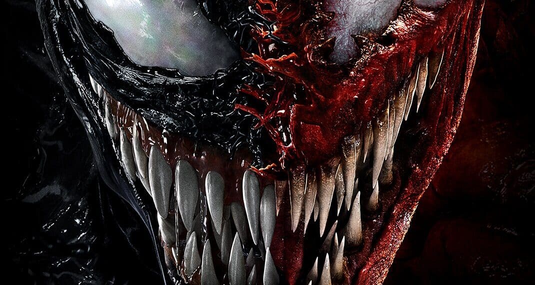 Imagem em grande plano do Venom SpiderMan 2, mostrando o seu rosto ameaçador com dentes afiados, um lado preto e o outro vermelho, realçando o aspeto icónico e temível da personagem.