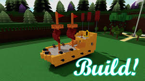 Roblox Build a Boat for Treasure scene showing a colorful custom-built boat with sails and flags in a grassy build zone, with glowing “Build!” text in the corner.