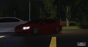 Roblox Greenville night scene showing a red car with headlights on, parked near a white car under streetlights with trees in the background and road markings visible.