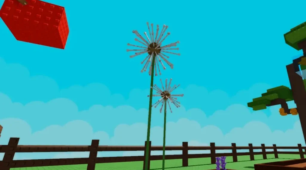 Two tall dandelion plants with spherical, fluffy seed heads in a Roblox garden setting, surrounded by fences, trees, and other plants.
