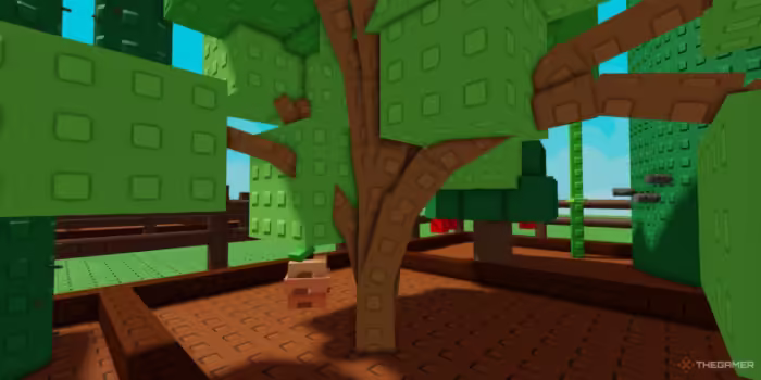 A raspberry bush grows beneath leafy block trees in Roblox’s "Grow a Garden," surrounded by soil plots and a fenced garden area.