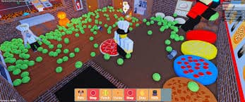 Roblox Work at a Pizza Place kitchen filled with green pet toys scattered across the floor, chefs preparing pizzas, and colorful toppings on counters.