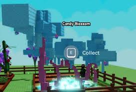 Candy Blossom tree with blue blocks and pink trunk inside a fenced plot in Grow a Garden, showing “Collect” prompt and glowing water below. 